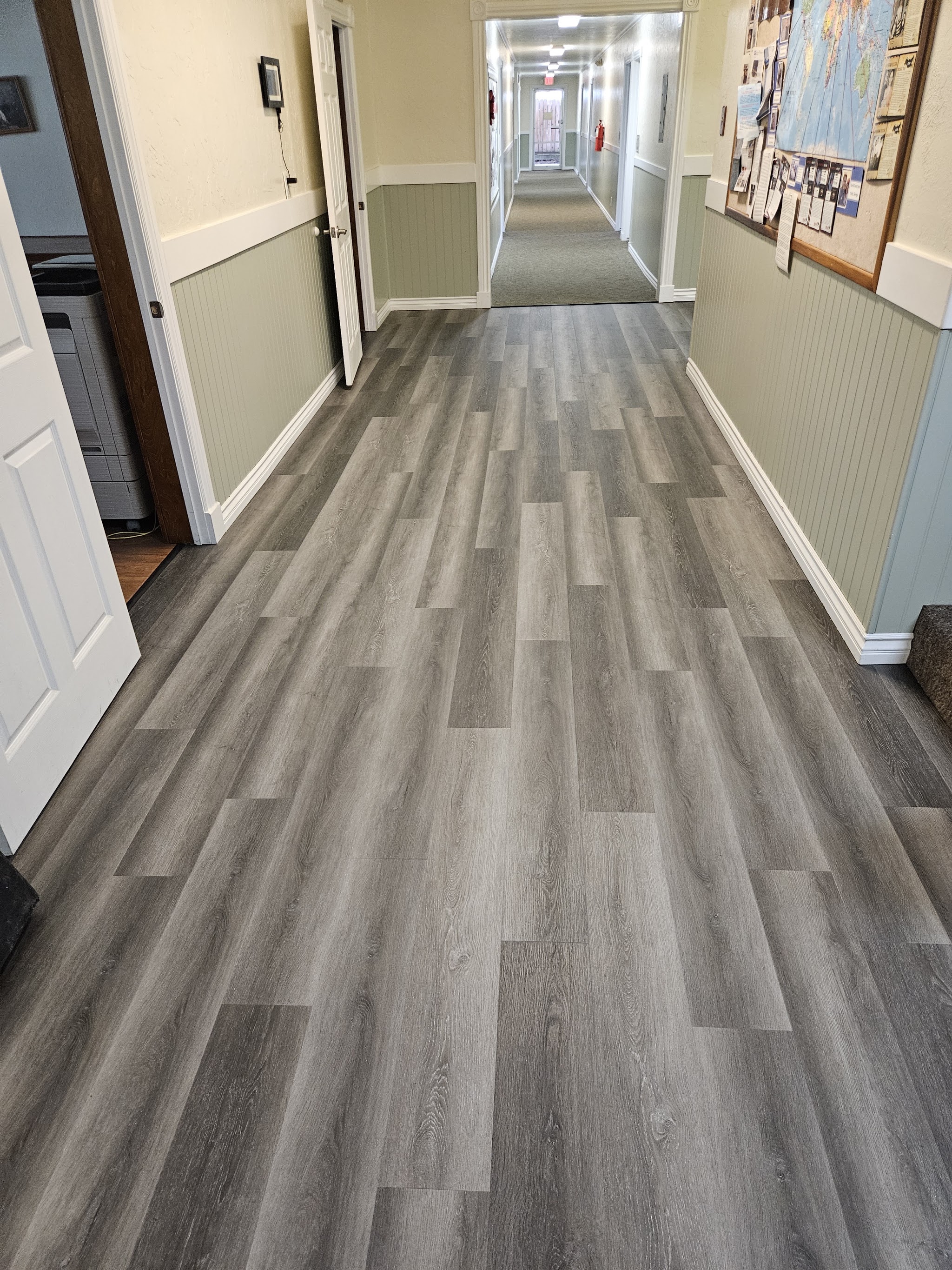 Finished wood-look flooring in a commercial hallway