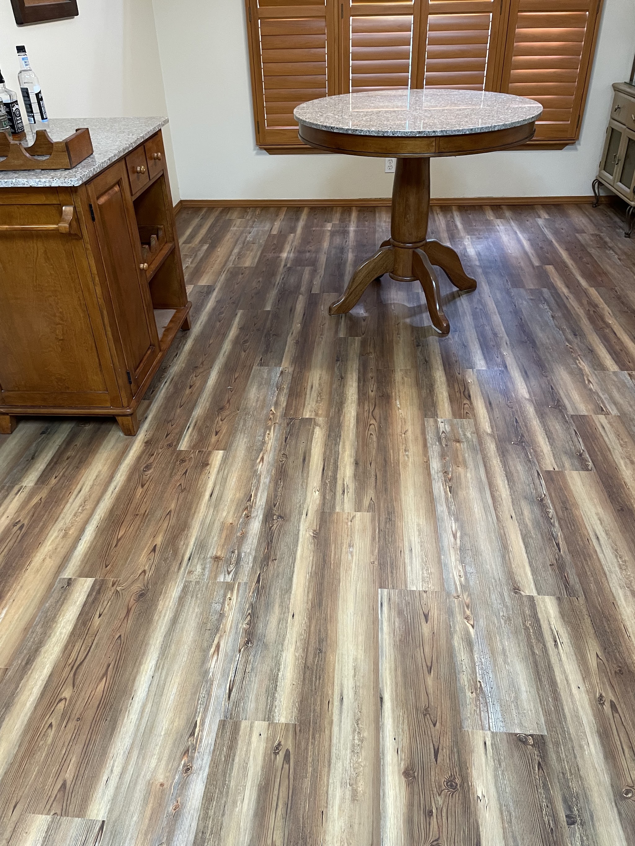 Finished wood-look vinyl plank flooring installed by JV Floors